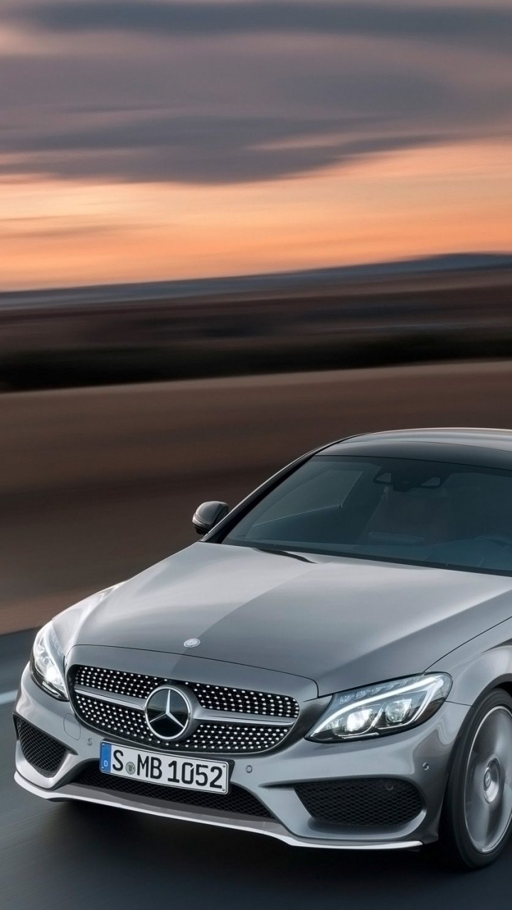 Silver Mercedes Benz Coupe on Road. Wallpaper in 720x1280 Resolution