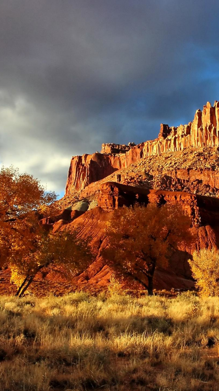 Brown Rock Formation Under Cloudy Sky During Daytime. Wallpaper in 750x1334 Resolution