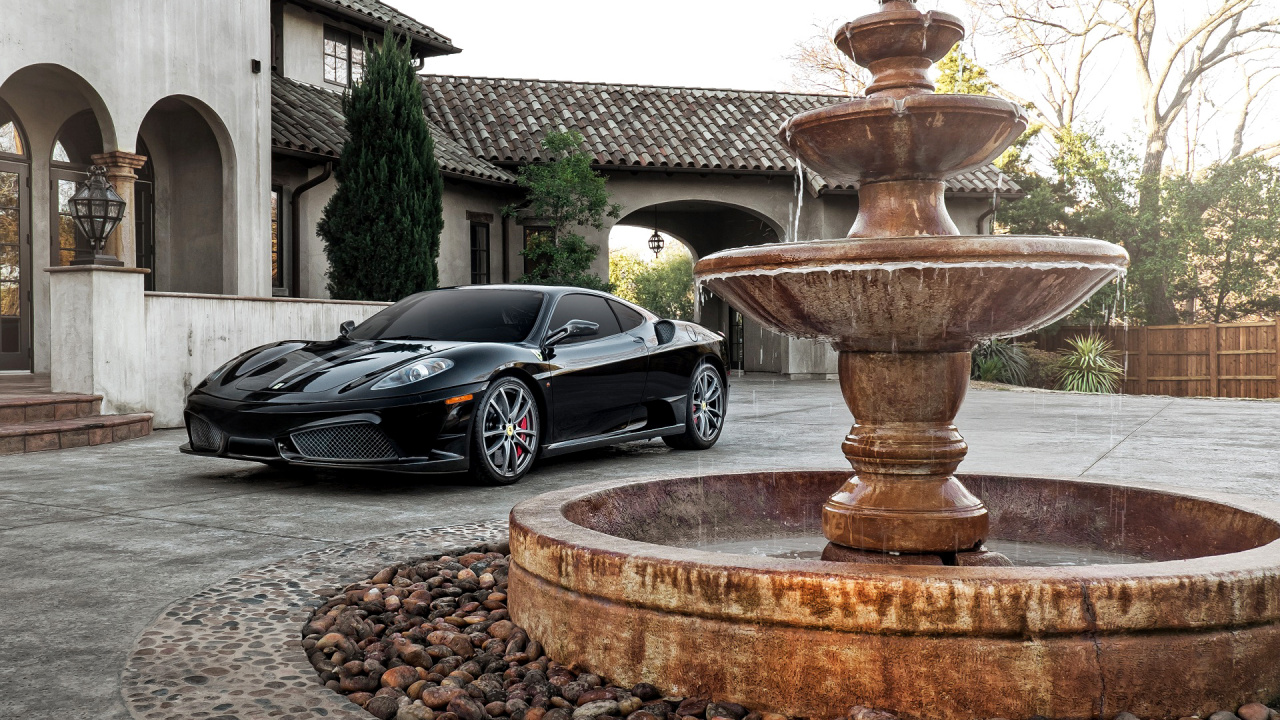 Coupé Noir Garé à Côté D'une Fontaine en Béton Brun Pendant la Journée. Wallpaper in 1280x720 Resolution
