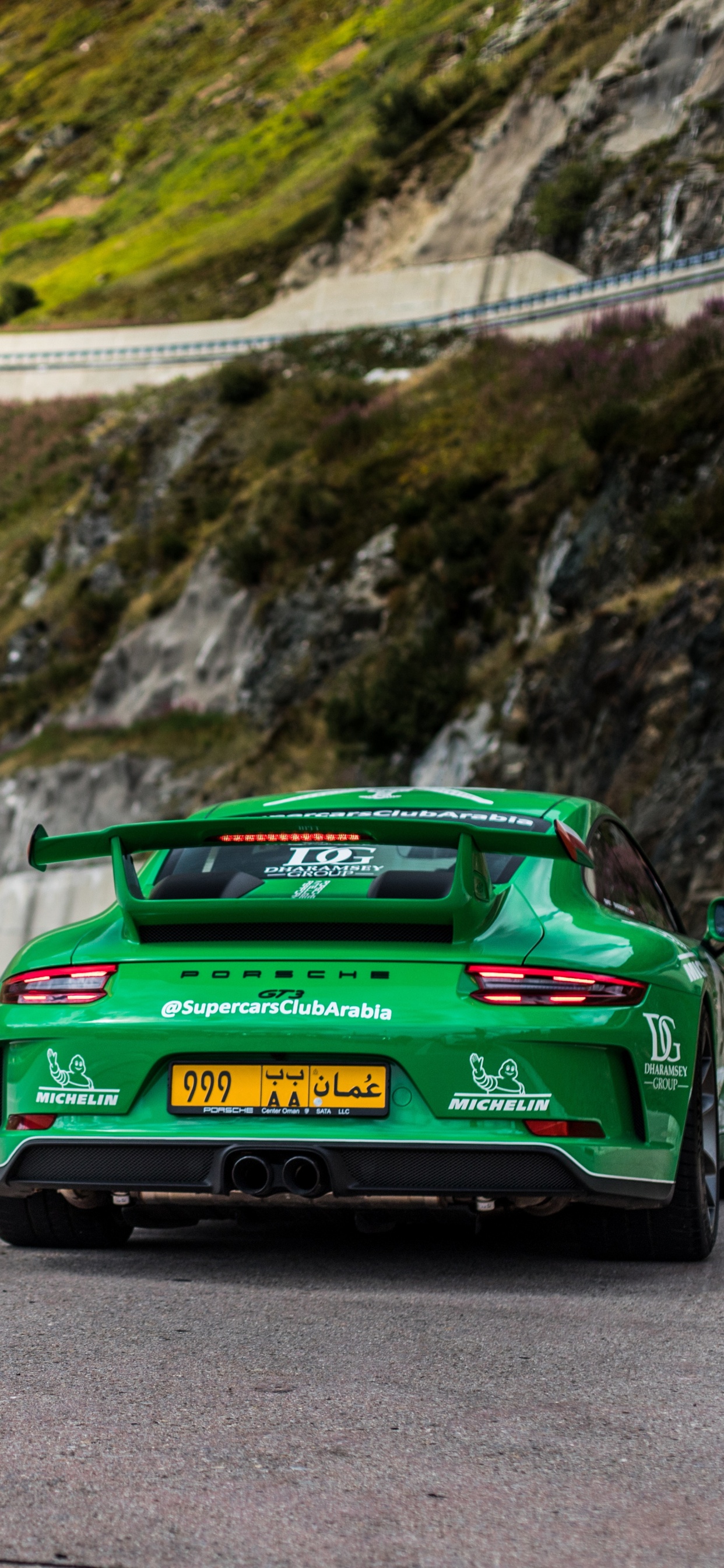 Green Porsche 911 on Road During Daytime. Wallpaper in 1242x2688 Resolution