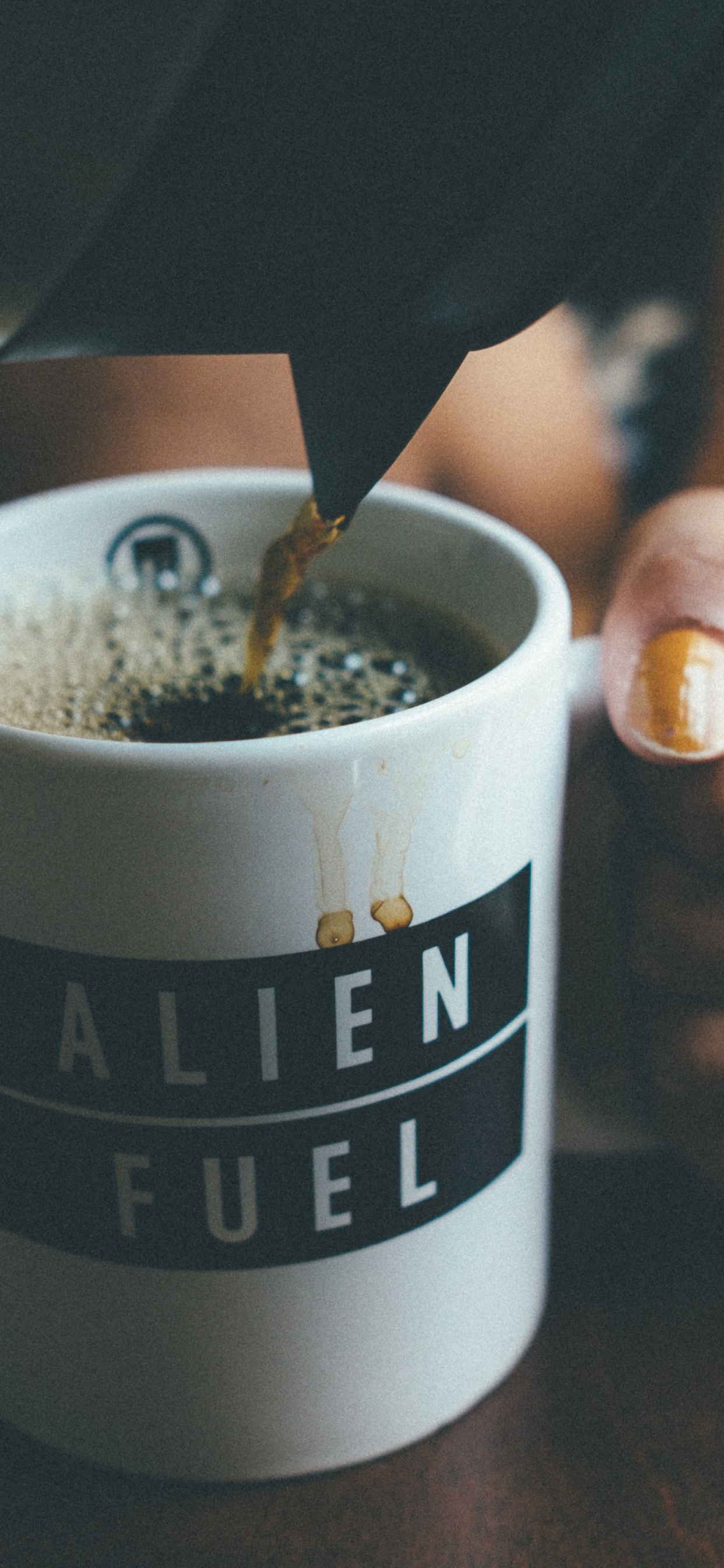 Person Holding White and Black Ceramic Mug With Coffee. Wallpaper in 1242x2688 Resolution