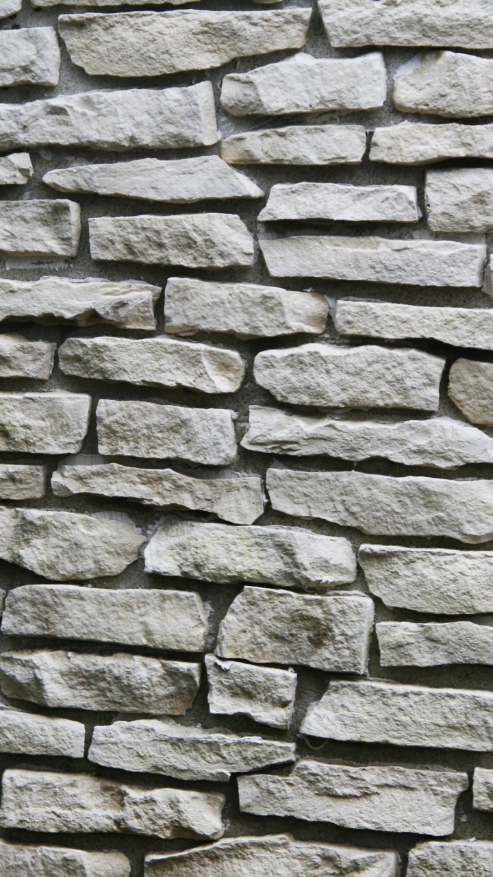 Braune Und Graue Backsteinmauer. Wallpaper in 720x1280 Resolution