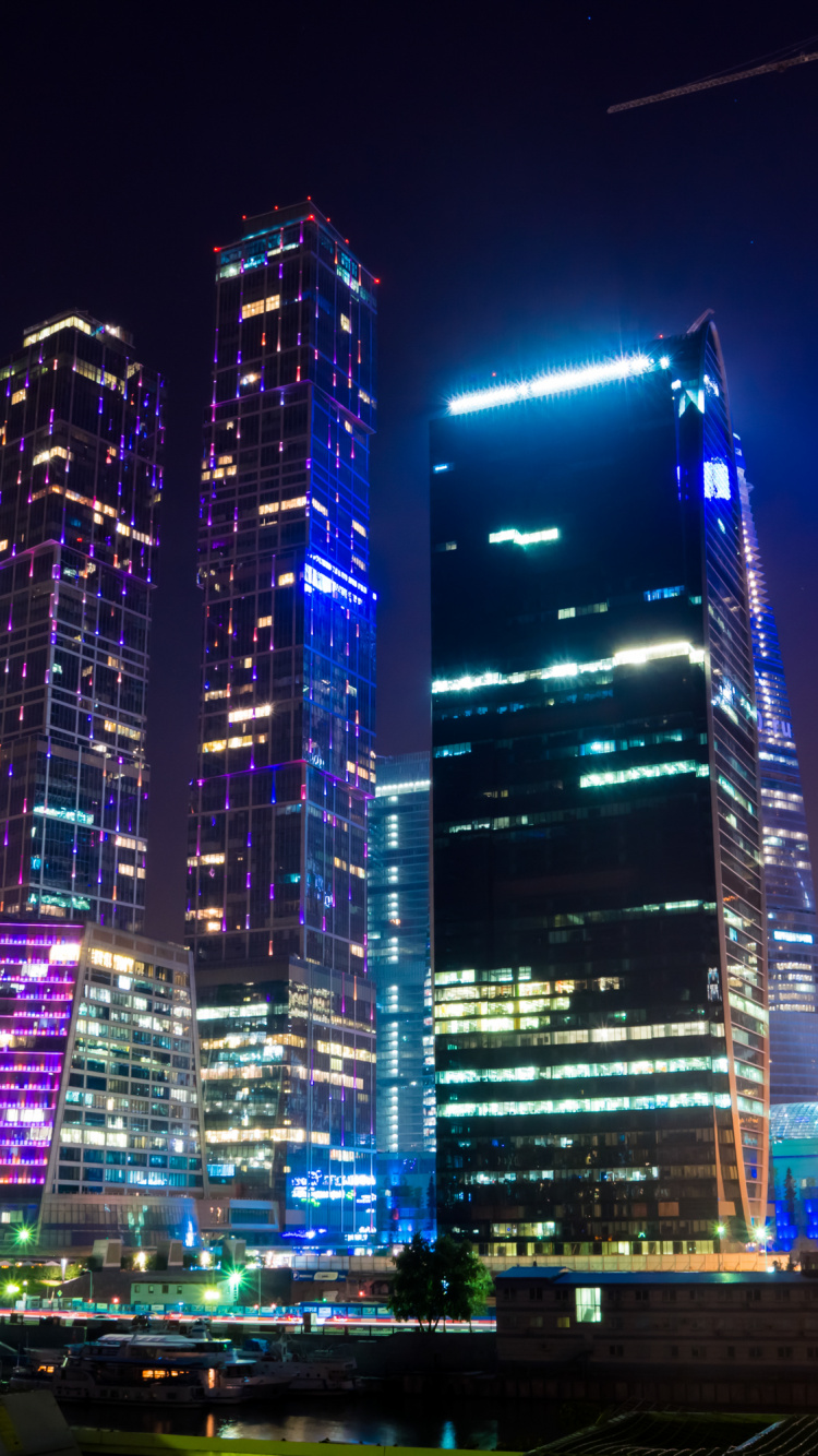 City Buildings With Lights During Night Time. Wallpaper in 750x1334 Resolution