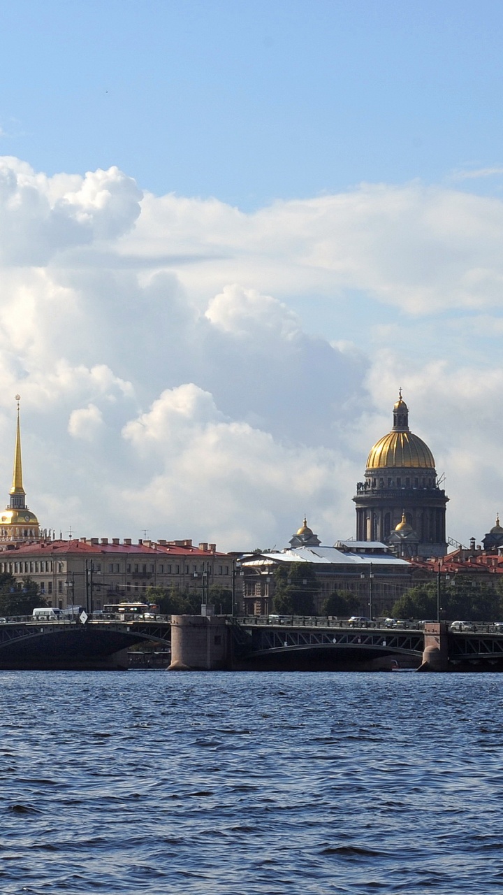 Brown Concrete Building Near Body of Water During Daytime. Wallpaper in 720x1280 Resolution