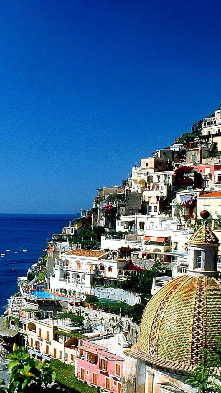 Aerial View of City Buildings Near Sea During Daytime. Wallpaper in 750x1334 Resolution