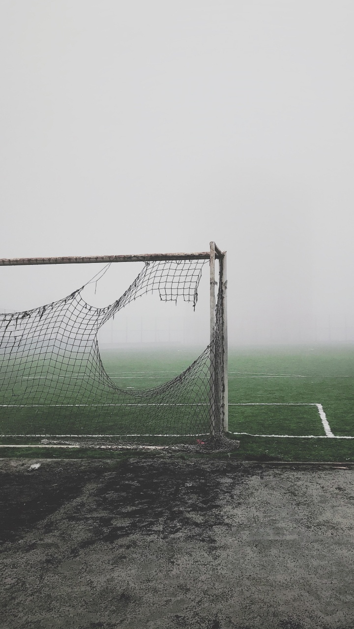 White Soccer Goal Net on Green Grass Field. Wallpaper in 720x1280 Resolution