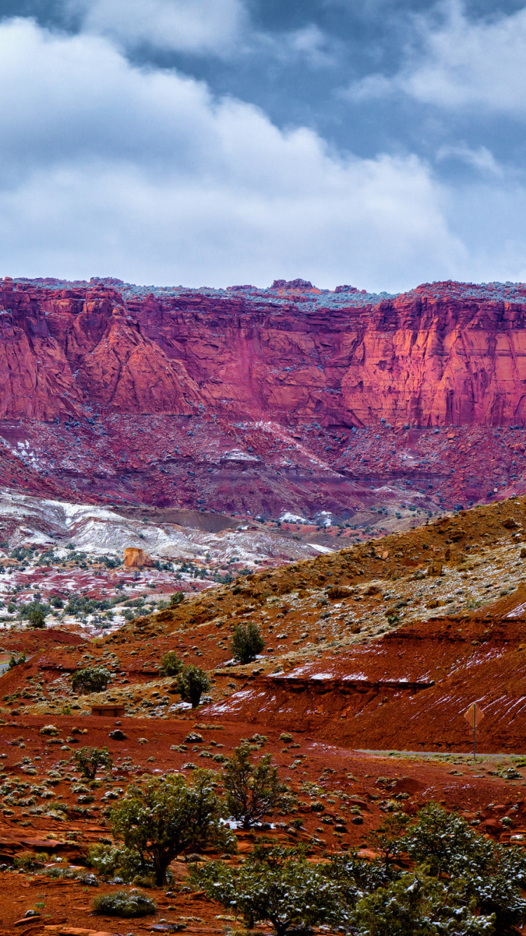 Brown and Gray Mountains Under White Clouds During Daytime. Wallpaper in 750x1334 Resolution