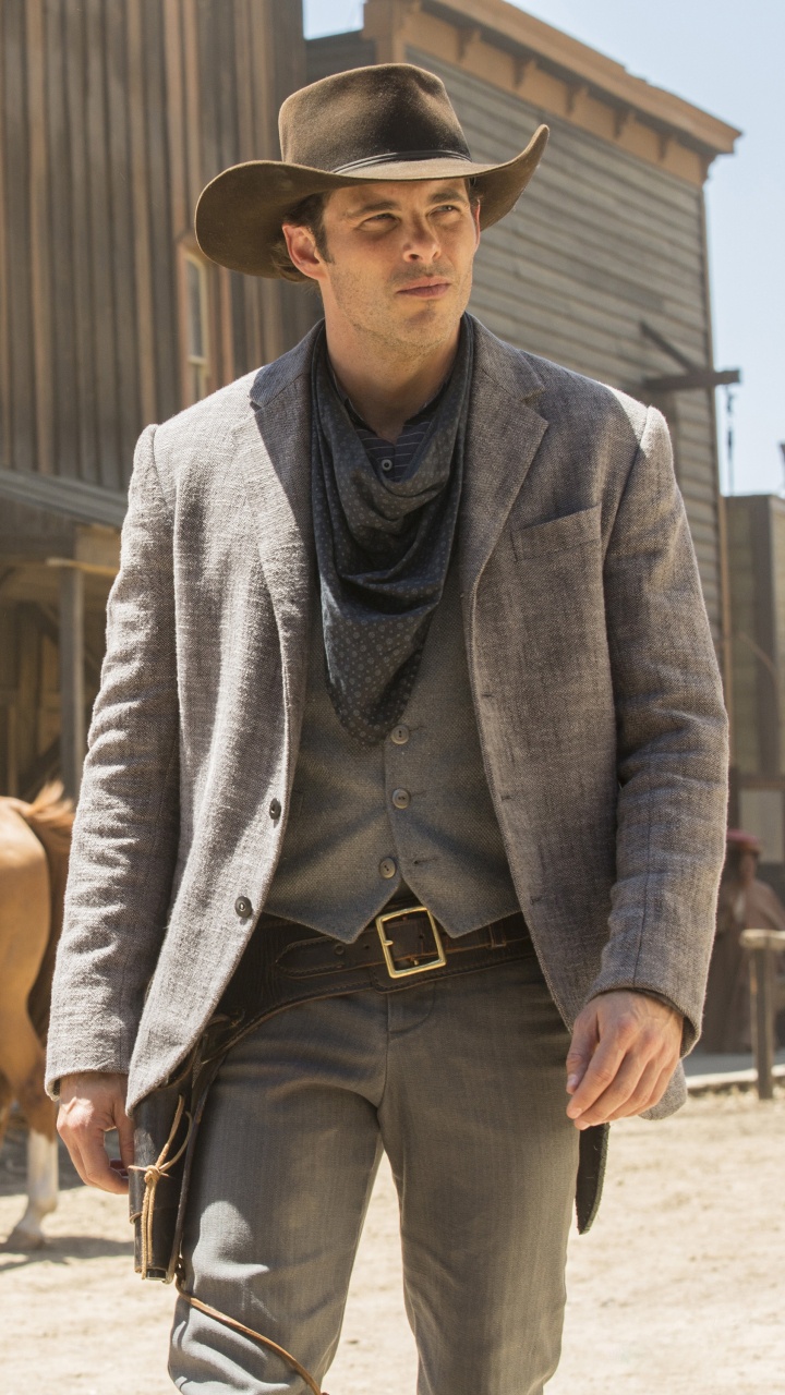 Man in Gray Blazer and Black Cowboy Hat Holding Brown Horse. Wallpaper in 720x1280 Resolution