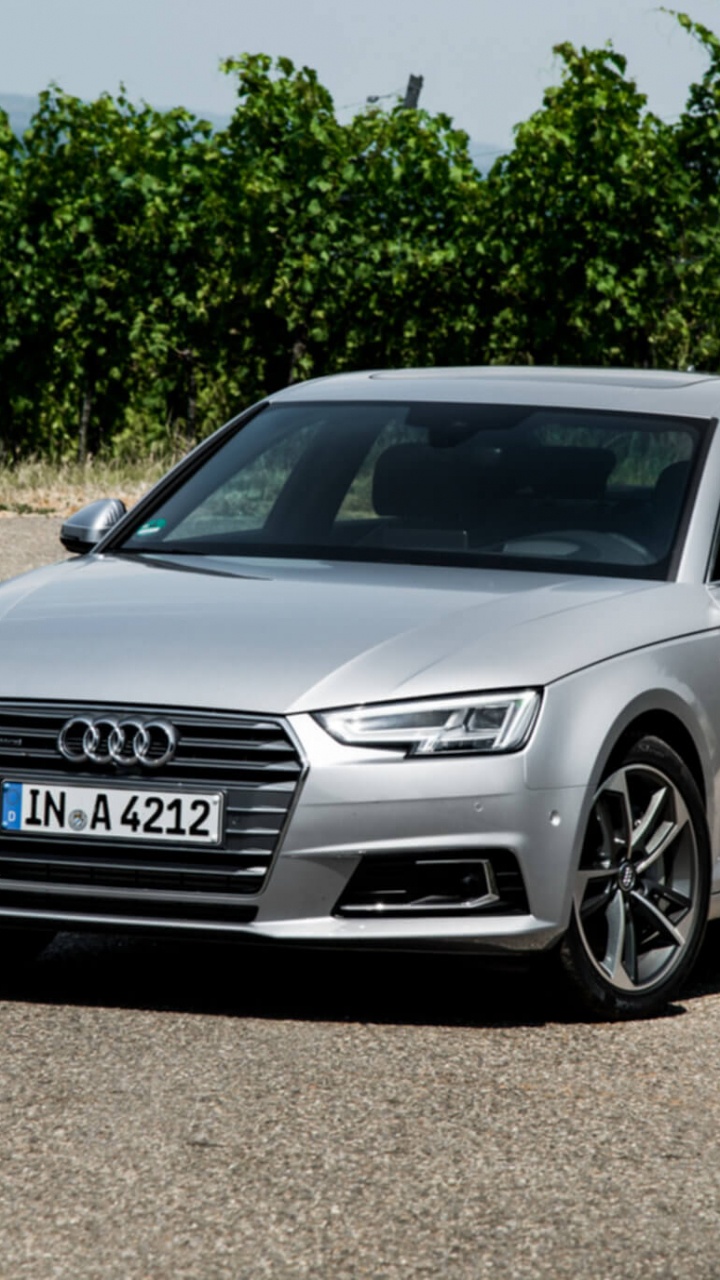 Black Audi a 4 Sedan Parked on Gray Asphalt Road During Daytime. Wallpaper in 720x1280 Resolution