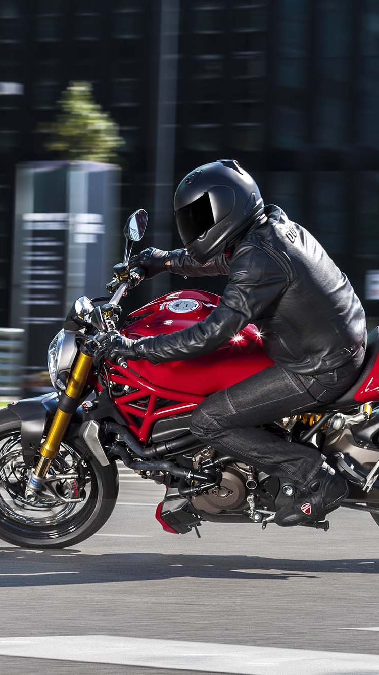 Man in Black Jacket Riding Red and Black Sports Bike. Wallpaper in 750x1334 Resolution