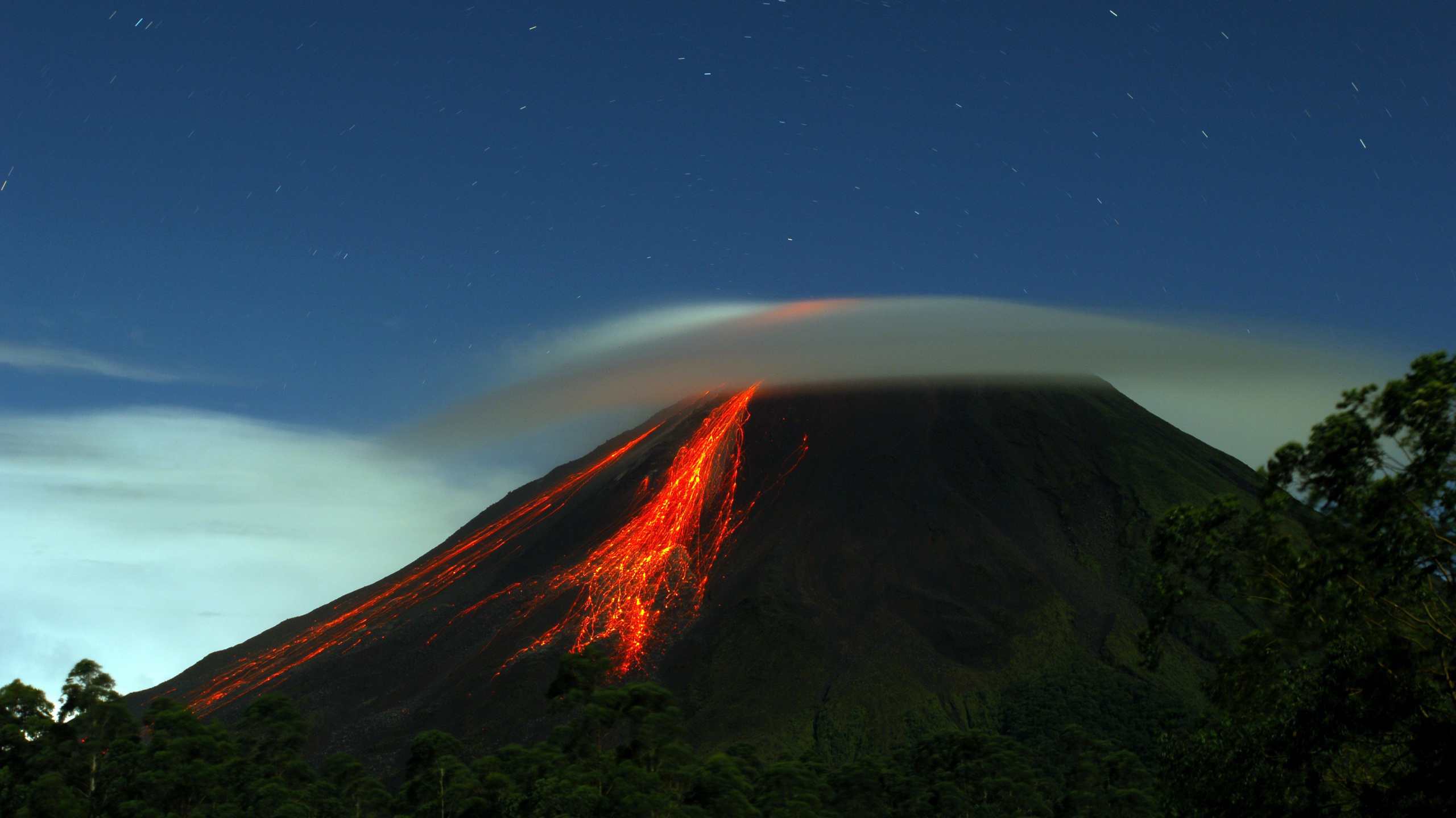Brown and Green Mountain Under Blue Sky During Night Time. Wallpaper in 2560x1440 Resolution