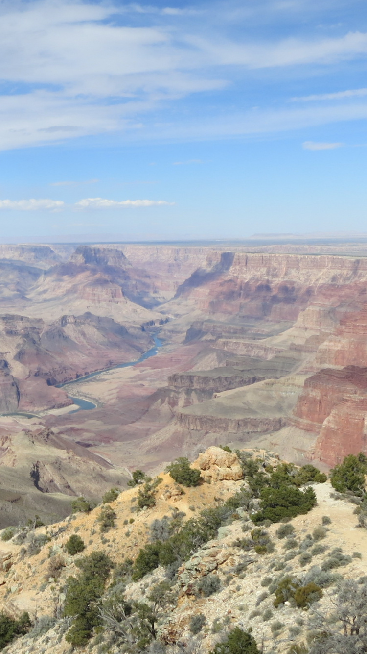 Brown and Green Mountains Under Blue Sky During Daytime. Wallpaper in 750x1334 Resolution