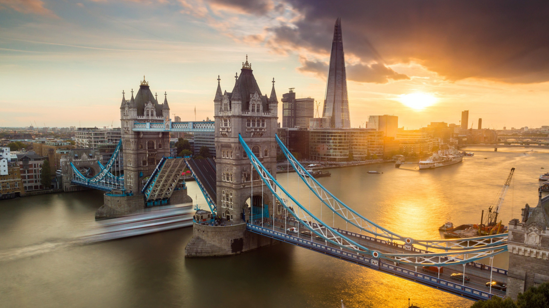 Bridge Over River Near City Buildings During Night Time. Wallpaper in 1920x1080 Resolution