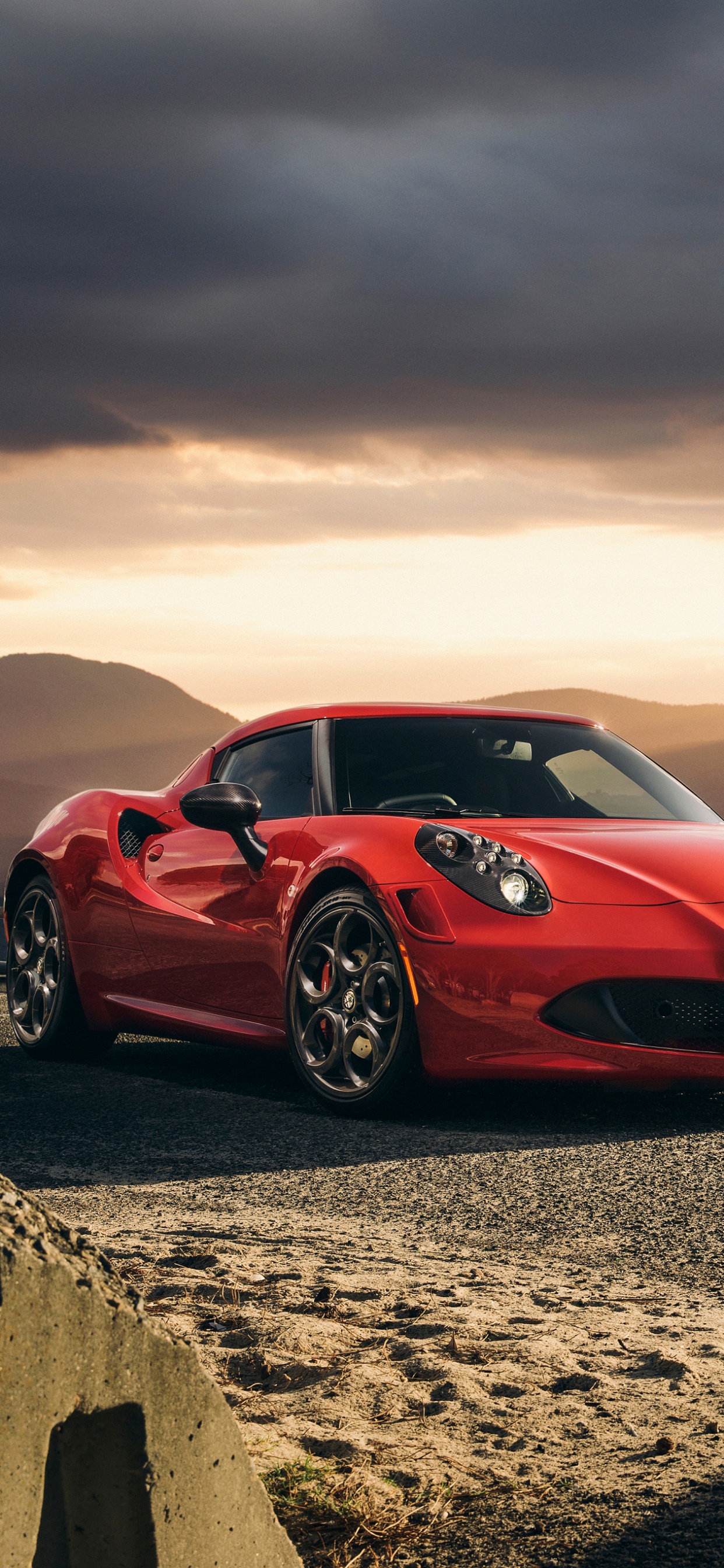 Roter Ferrari 458 Italia Auf Braunem Sand Bei Sonnenuntergang. Wallpaper in 1242x2688 Resolution