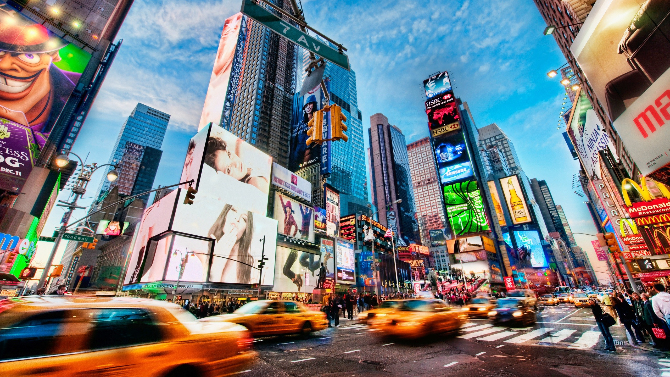 Cars on Road Near High Rise Buildings During Daytime. Wallpaper in 2560x1440 Resolution