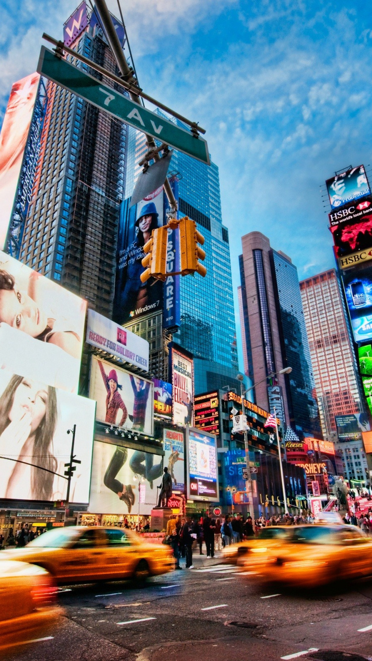 Voitures Sur Route Près Des Immeubles de Grande Hauteur Pendant la Journée. Wallpaper in 750x1334 Resolution