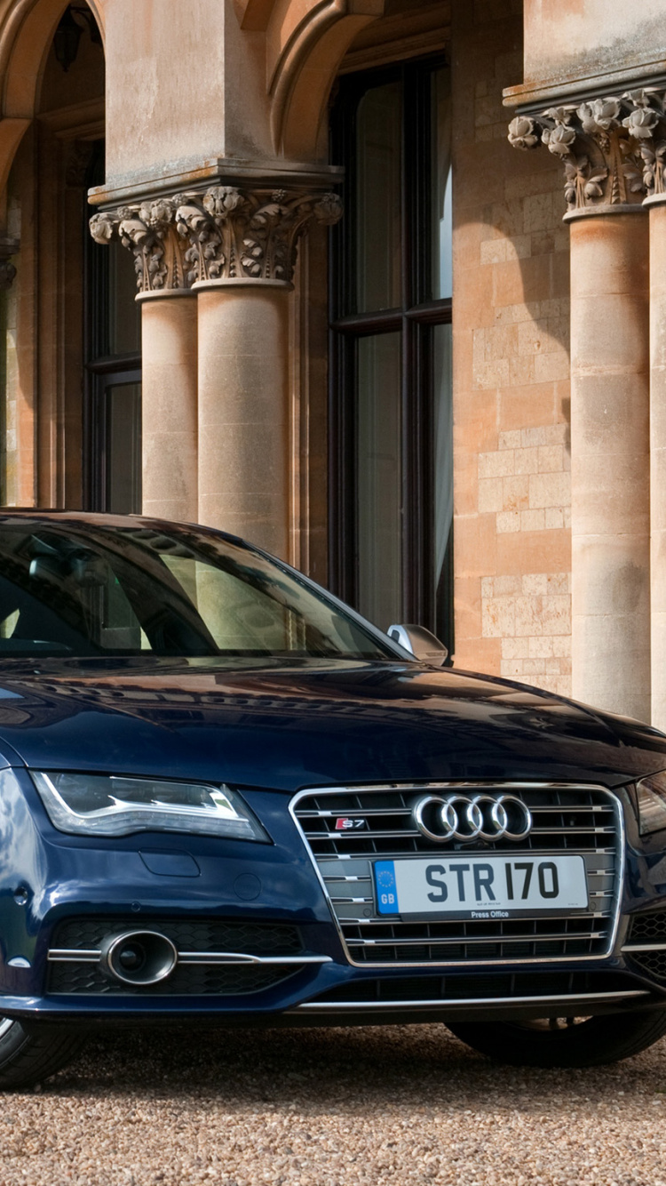 Blue Bmw m 3 Coupe Parked Near Brown Concrete Building During Daytime. Wallpaper in 750x1334 Resolution