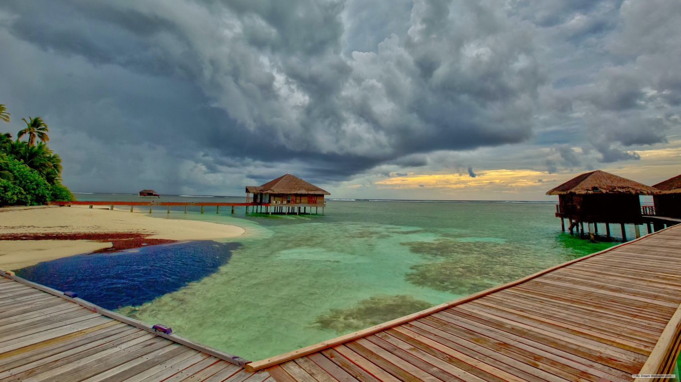 Brown Wooden Dock on Sea Under White Clouds During Daytime. Wallpaper in 1366x768 Resolution