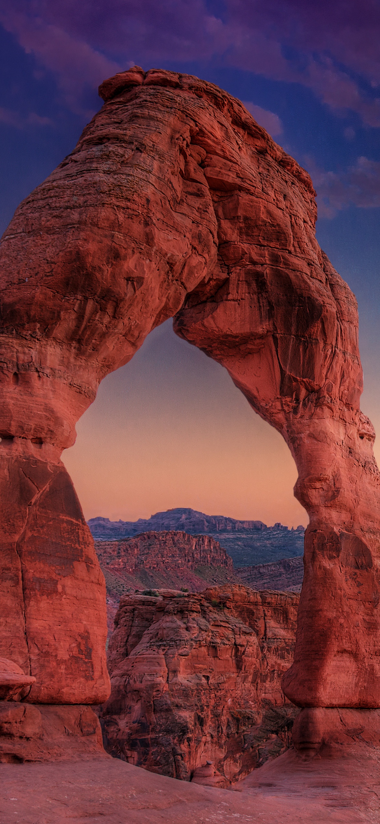 Brown Rock Formation Near Body of Water During Daytime. Wallpaper in 1242x2688 Resolution