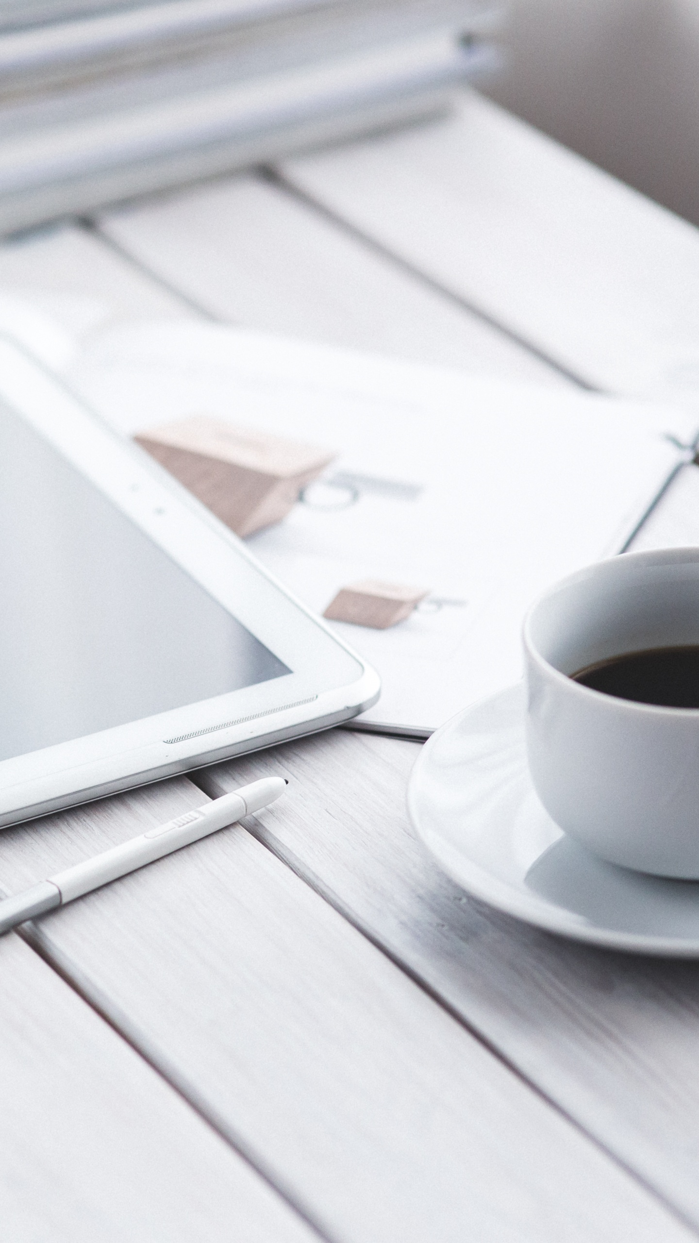 White Ipad on White Book Page Beside White Ceramic Mug on Table. Wallpaper in 1440x2560 Resolution