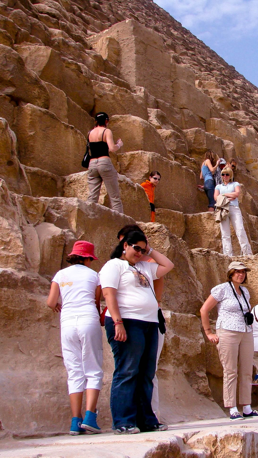 Group of People Standing on Brown Rock Formation During Daytime. Wallpaper in 1080x1920 Resolution