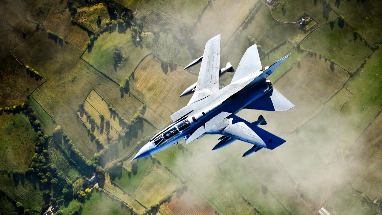 White and Blue Jet Plane Flying Over Green Grass Field During Daytime. Wallpaper in 1280x720 Resolution