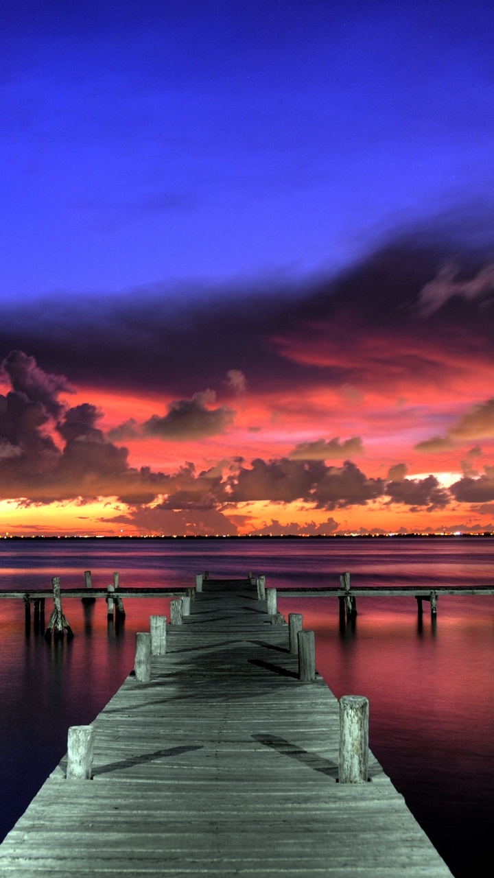 Brown Wooden Dock on Body of Water During Sunset. Wallpaper in 720x1280 Resolution