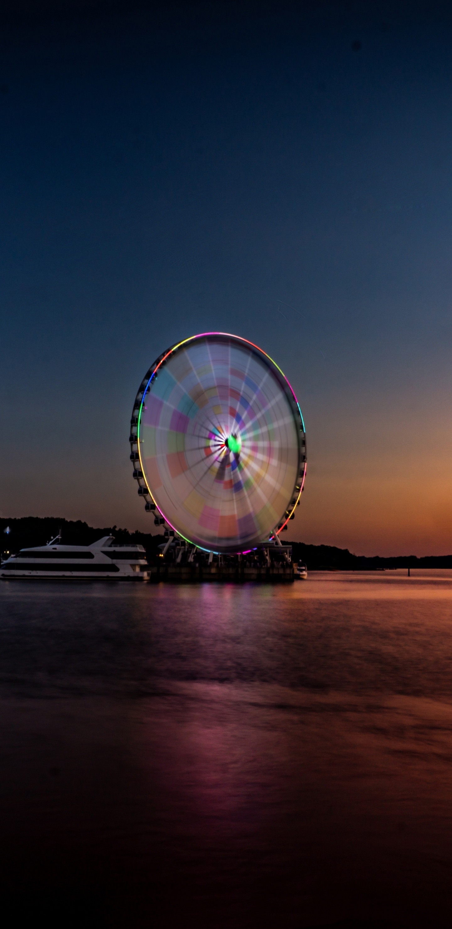 Ferris Wheel Near Body of Water During Night Time. Wallpaper in 1440x2960 Resolution