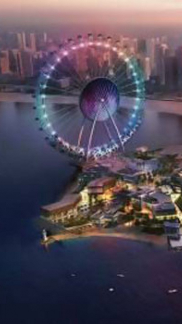 Vista Aérea de Los Edificios de la Ciudad Durante la Noche.. Wallpaper in 720x1280 Resolution