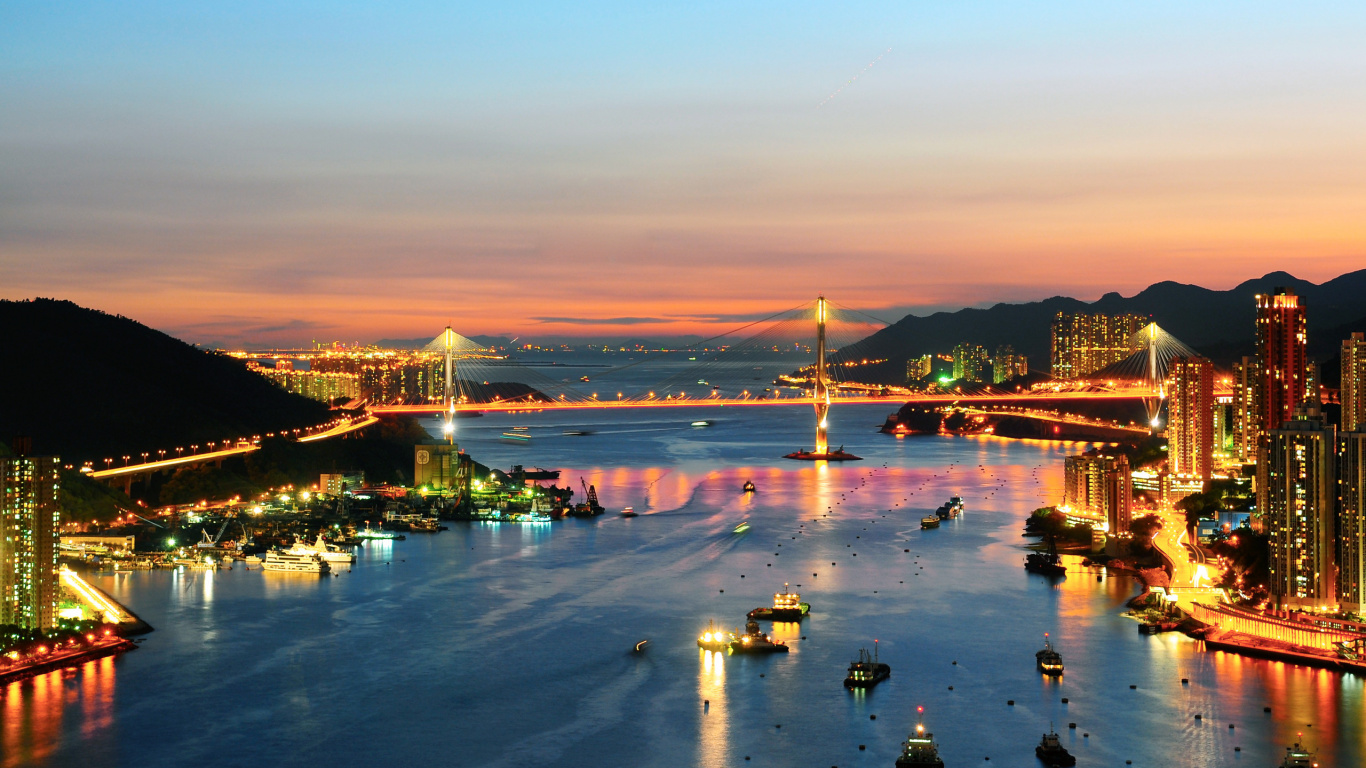 People on Beach Near Bridge During Night Time. Wallpaper in 1366x768 Resolution