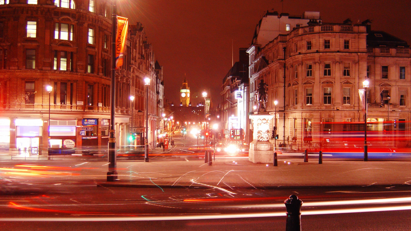 Person in Black Coat Standing on Road During Night Time. Wallpaper in 1366x768 Resolution