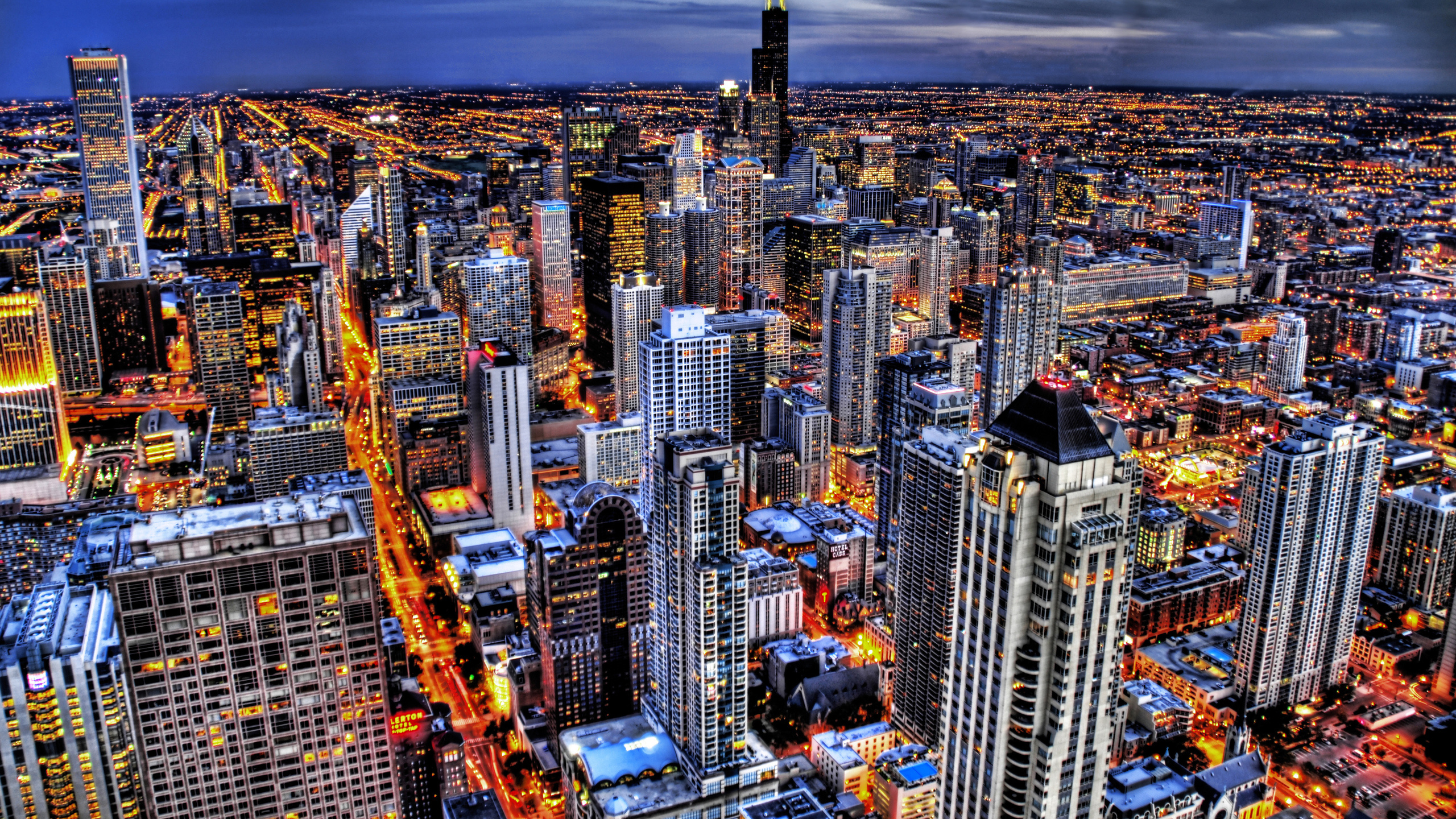 Aerial View of City Buildings During Night Time. Wallpaper in 2560x1440 Resolution