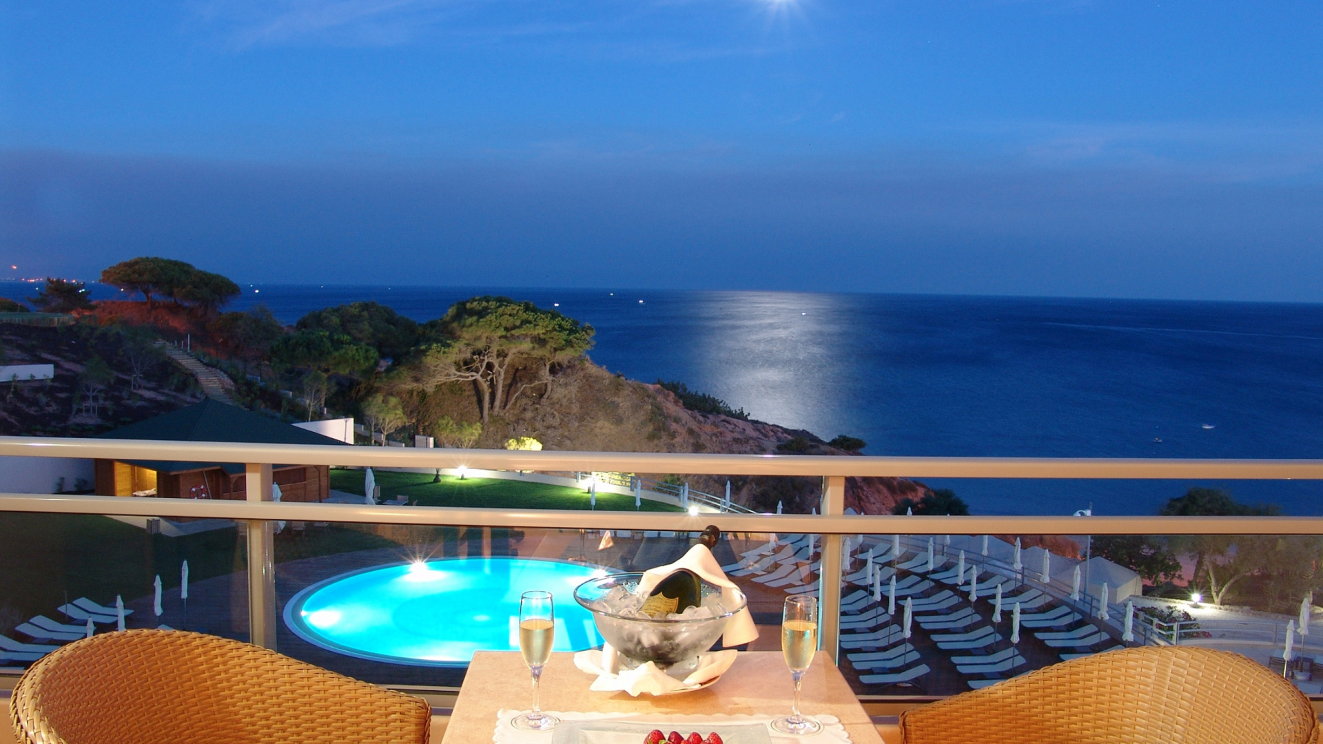 Brown Wooden Table and Chairs Near Blue Body of Water During Daytime. Wallpaper in 1920x1080 Resolution