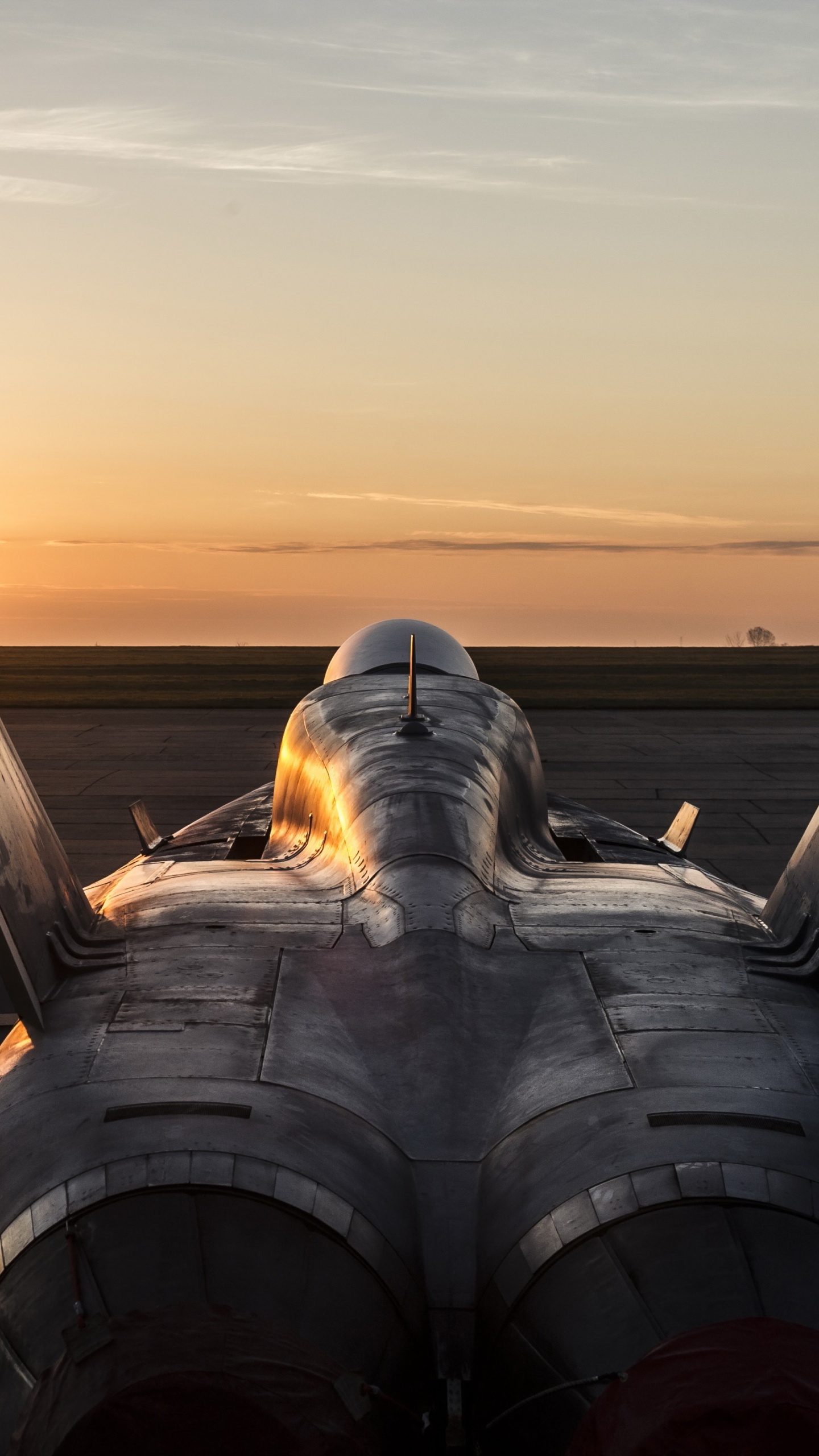 Man in White Shirt and Black Pants Sitting on Gray Metal Pipe During Sunset. Wallpaper in 1440x2560 Resolution