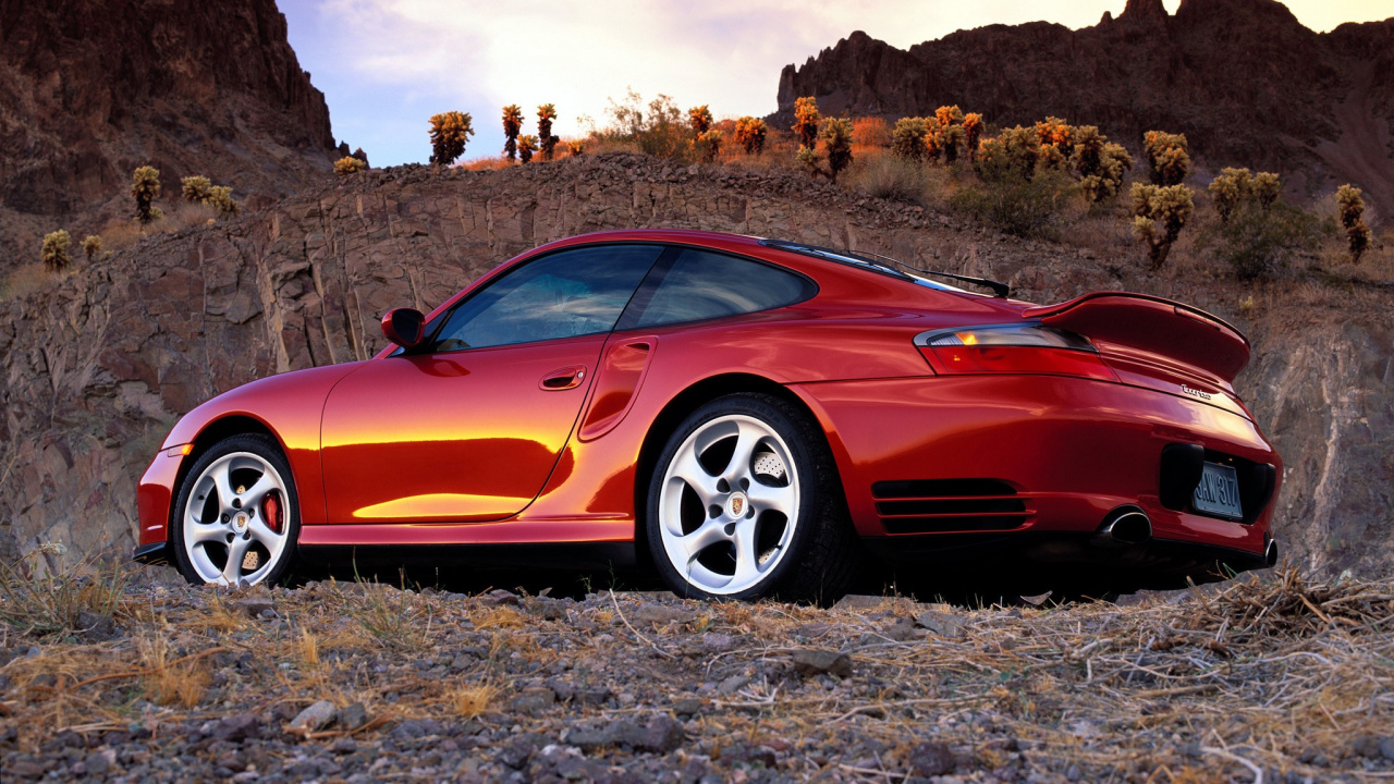 Red Ferrari 458 Italia on Brown Rocky Mountain During Daytime. Wallpaper in 1280x720 Resolution