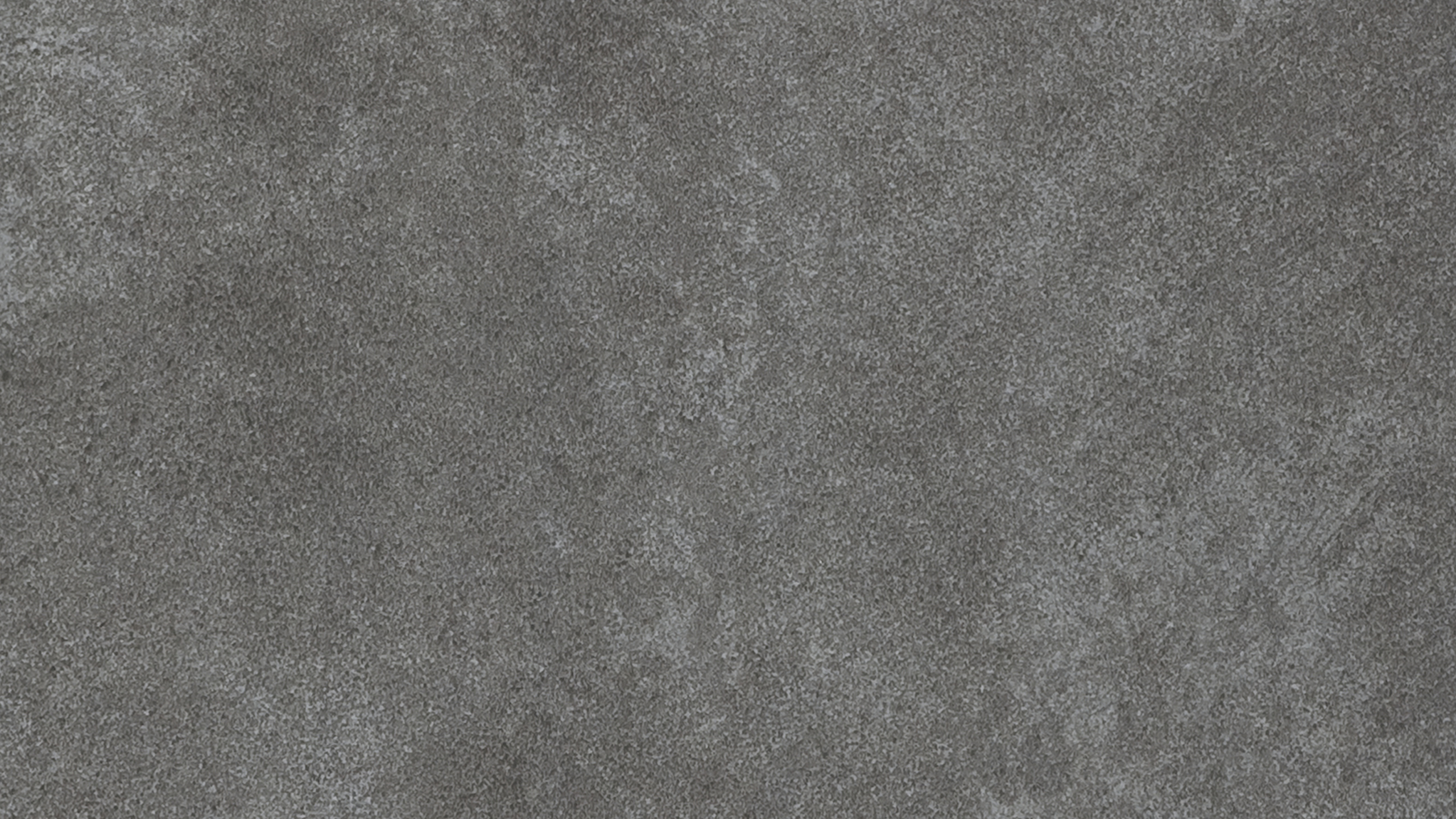 Person in Black Shoes Standing on Gray Carpet. Wallpaper in 2560x1440 Resolution