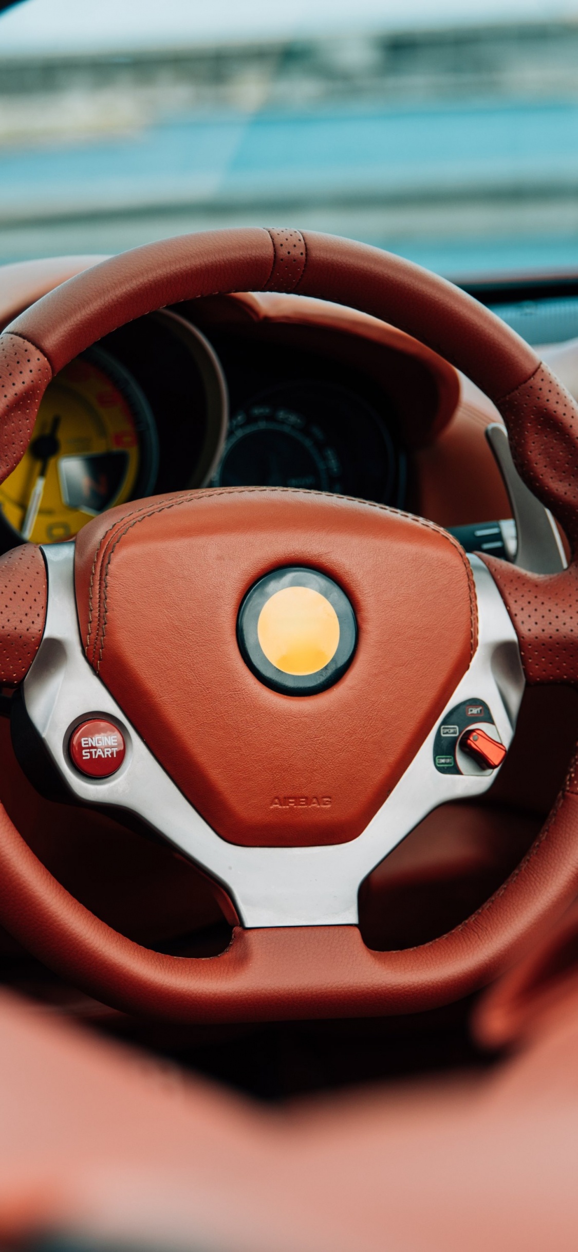 Volante Bmw Naranja y Negro. Wallpaper in 1125x2436 Resolution