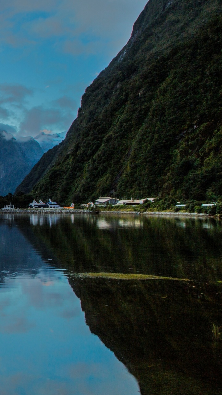 Lake Near Mountain Under White Clouds During Daytime. Wallpaper in 720x1280 Resolution