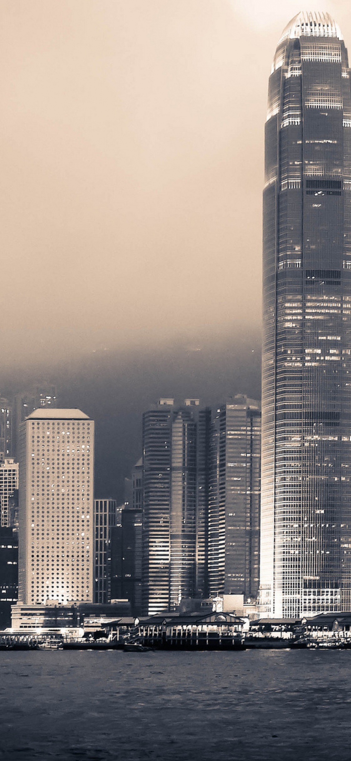 City Skyline During Night Time. Wallpaper in 1125x2436 Resolution