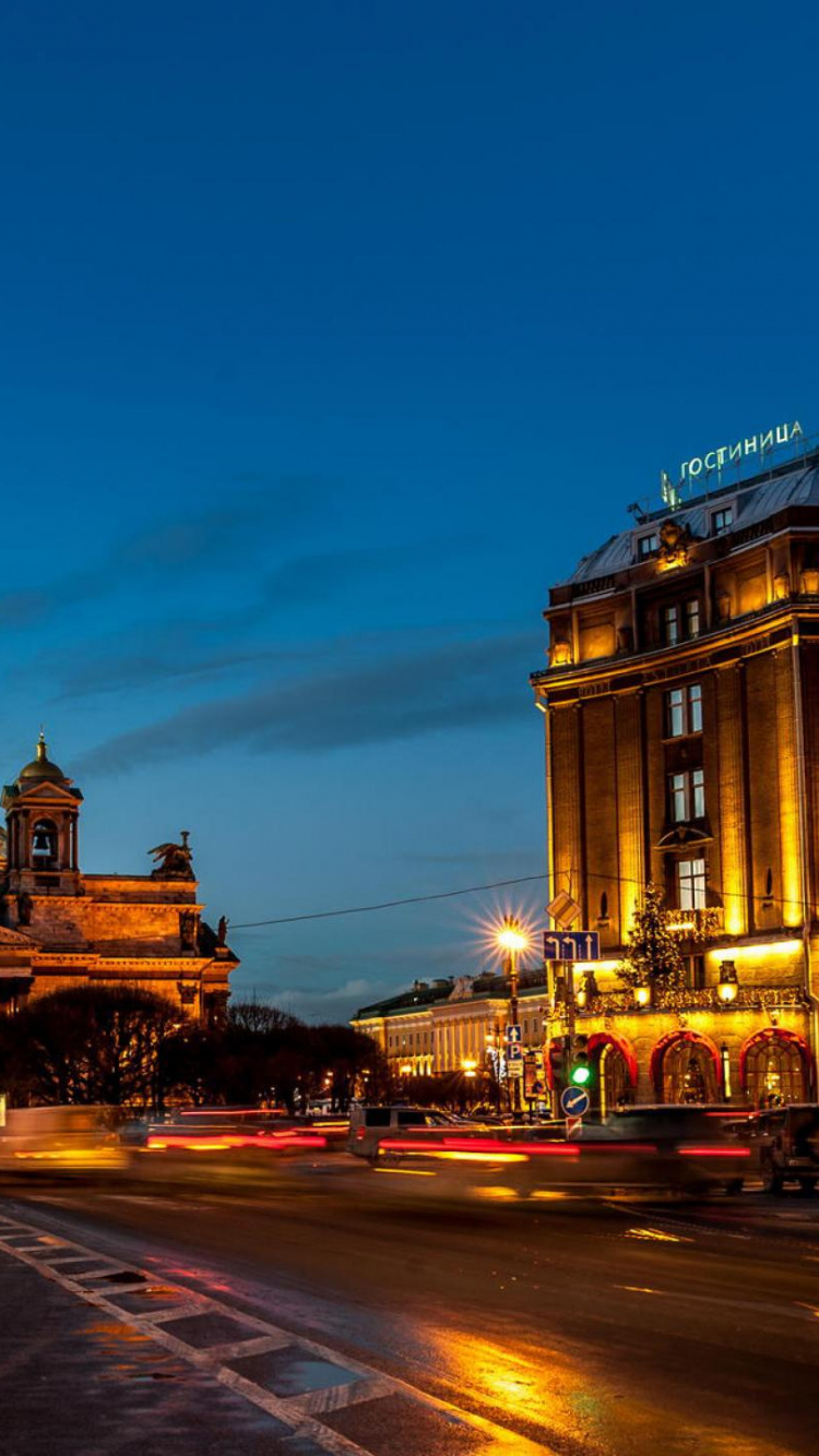 Cars on Road Near Building During Night Time. Wallpaper in 750x1334 Resolution