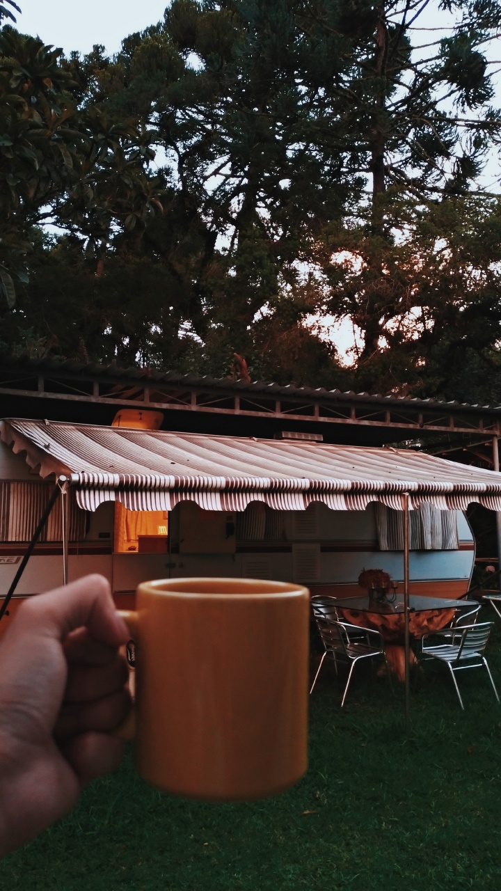 Person Holding Brown Ceramic Mug. Wallpaper in 720x1280 Resolution