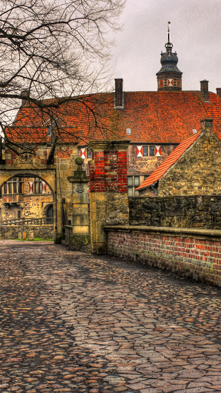 Brown Brick Building Near Bare Trees Under White Clouds During Daytime. Wallpaper in 750x1334 Resolution