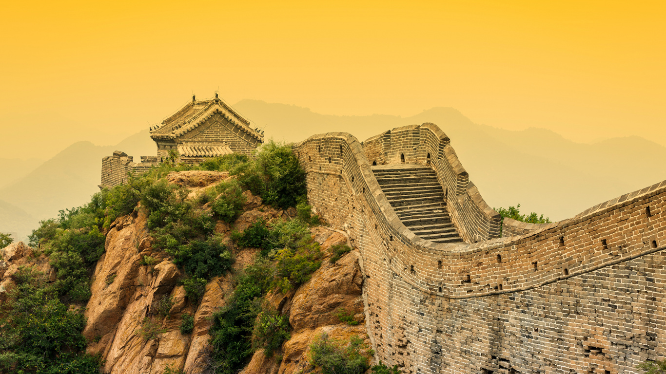 Brown Concrete Building on Brown Rocky Mountain During Daytime. Wallpaper in 1366x768 Resolution