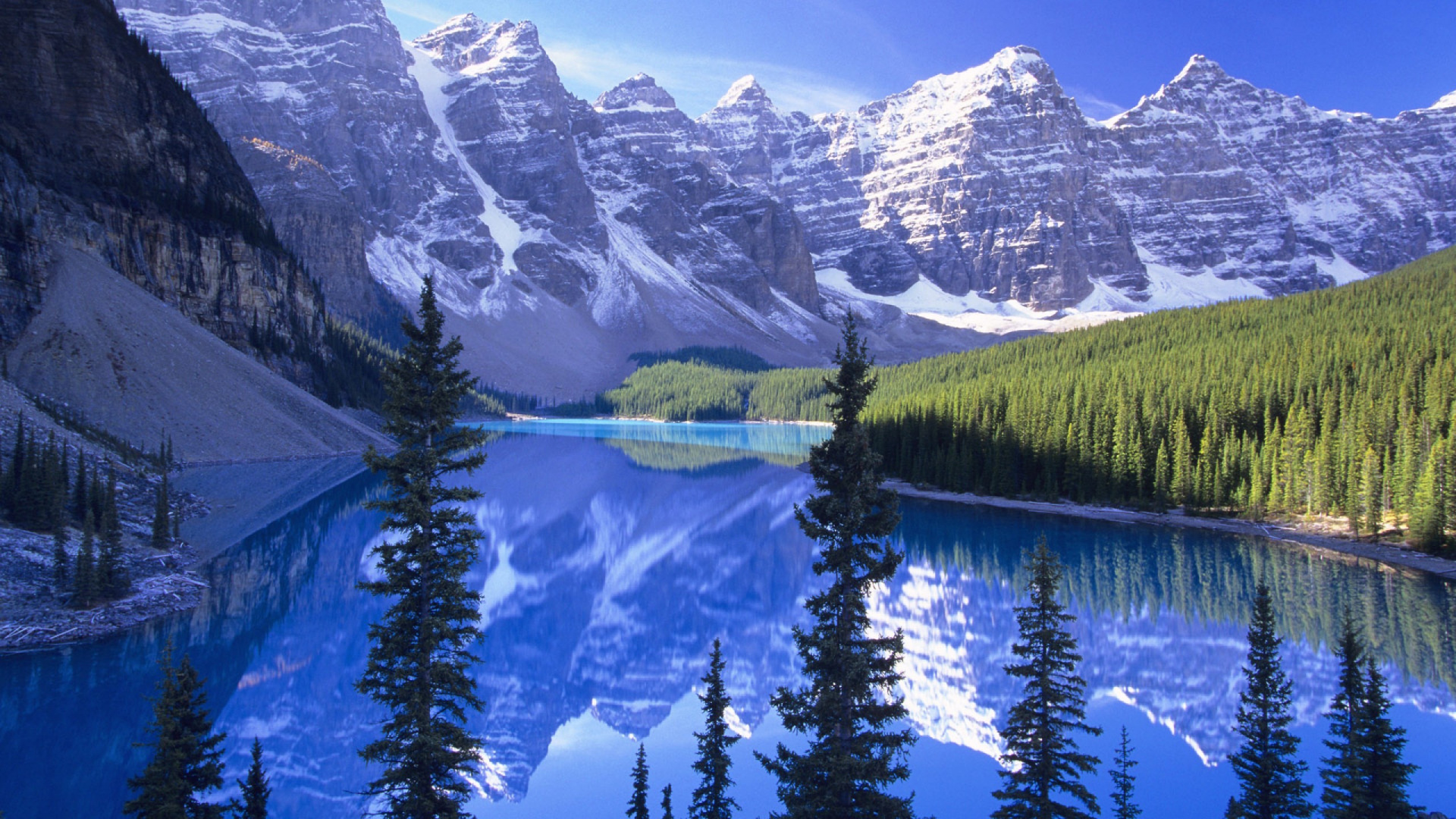 Lake Surrounded by Trees and Snow Covered Mountains During Daytime. Wallpaper in 1920x1080 Resolution