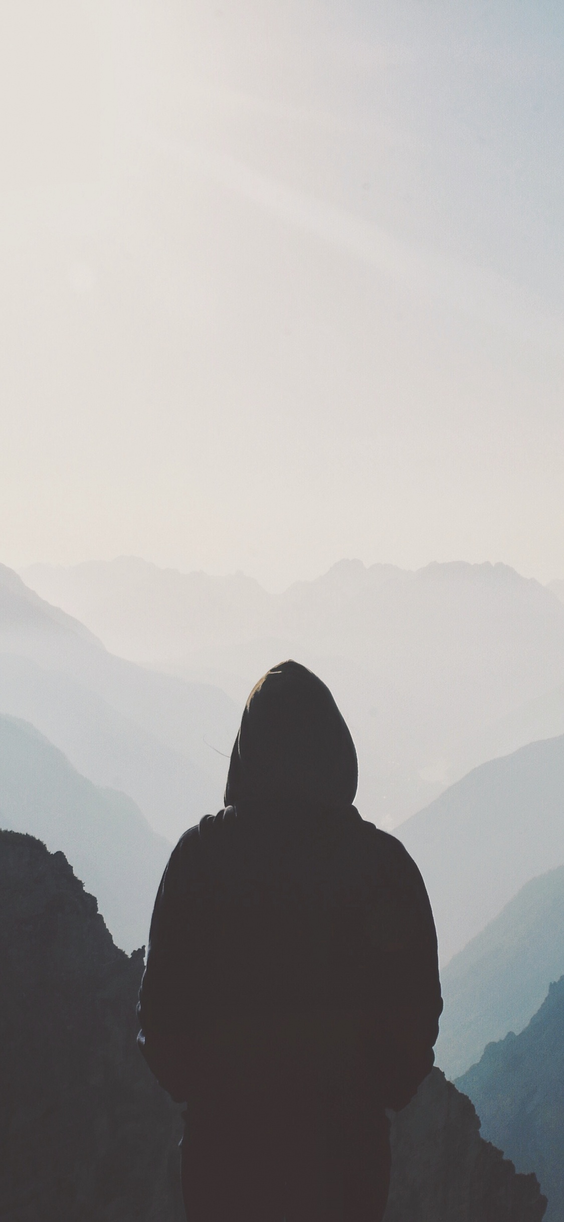 Silhouette of Person Standing on Top of Mountain During Daytime. Wallpaper in 1125x2436 Resolution