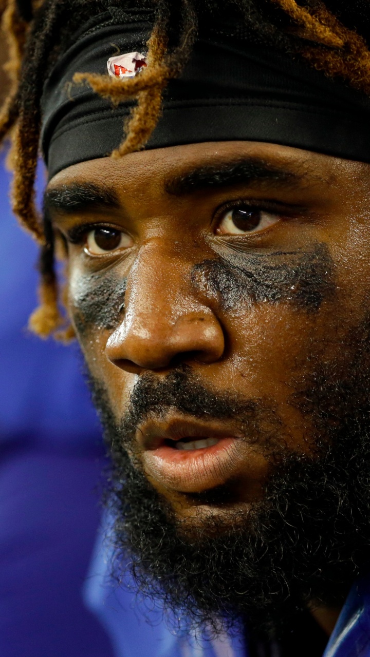 Man in Blue Shirt Wearing Brown Knit Cap. Wallpaper in 720x1280 Resolution