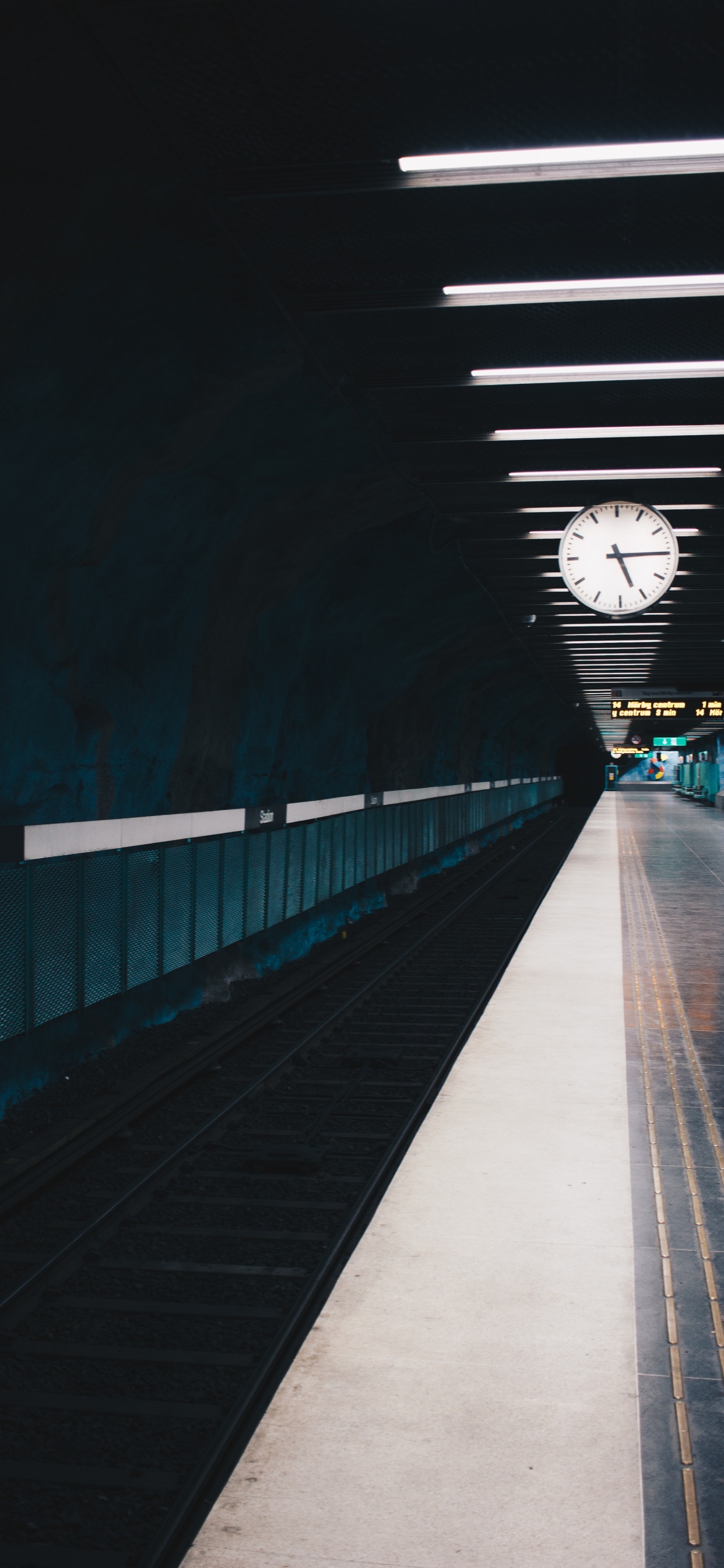 White and Black Tunnel With Lights Turned on During Night Time. Wallpaper in 1242x2688 Resolution