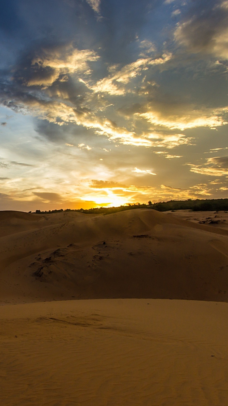 Brown Sand Under Blue Sky During Daytime. Wallpaper in 750x1334 Resolution