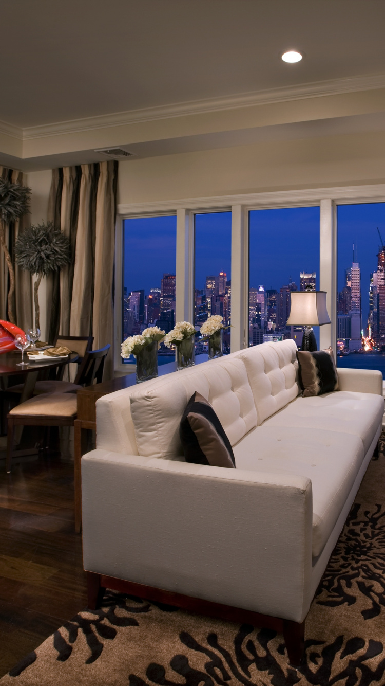 White Leather Couch Near Glass Window. Wallpaper in 750x1334 Resolution