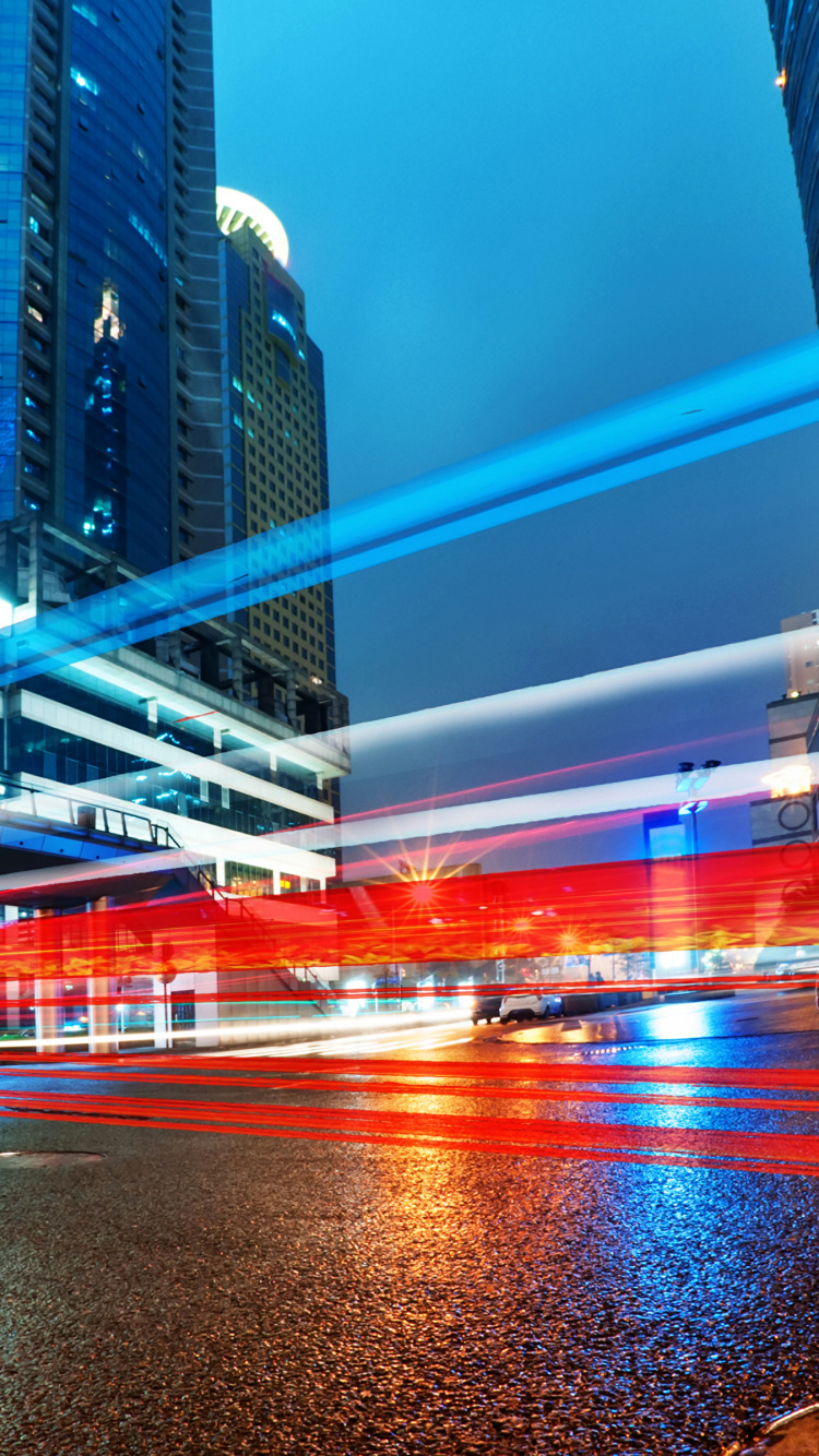 Bâtiments de la Ville Avec Des Lumières Allumées Pendant la Nuit. Wallpaper in 750x1334 Resolution